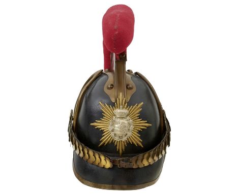 the black leather skull with brass trim, rayed star helmet plate with white metal Saxon centre, the raised comb with red clot