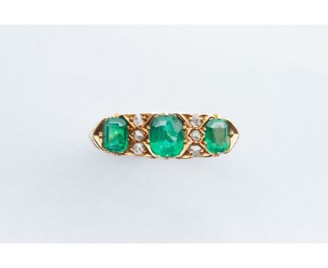 stamped 'S.U Ltd', some damages to middle emerald, ring size O, total weight 4.1 grams