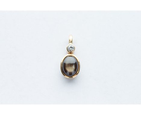 with a round brilliant cut diamond approx 0.07ct, sapphire measures 0.8mm x 0.6mm, pendant total weight 1.4 grams