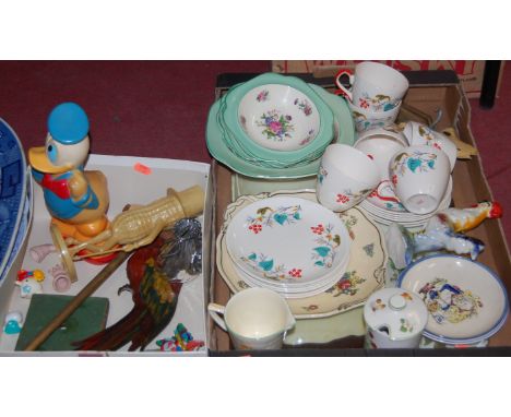 A mixed lot to include; 1950s teawares, painted ply parrot, enamel brooches, unframed and bevelled wall mirror etc 