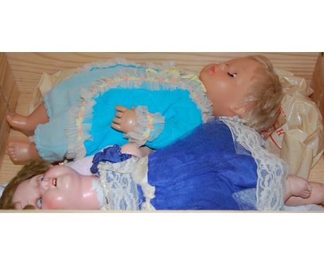 An early 20th century Heubach Koppelsdorf bisque headed German doll together with one other 1950s plastic headed  doll