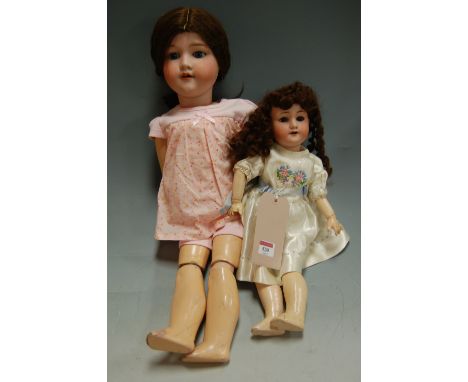 An early 20th century Armand Marseilles bisque headed doll; together with one other smaller example (2) Condition Report / Ex