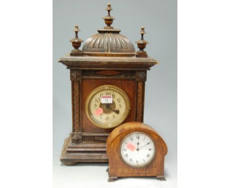 A circa 1900 Continental walnut cased mantel clock; and one other inlaid oak example (2)