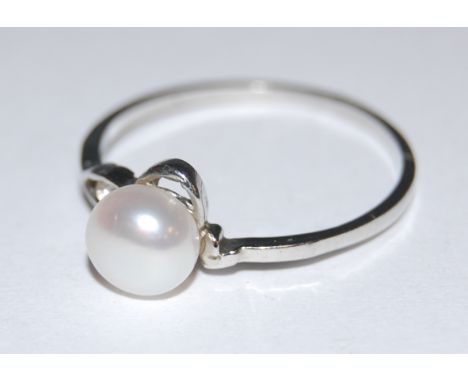 A salon style 18ct white gold cz and pearl set dress ring, circa 1975