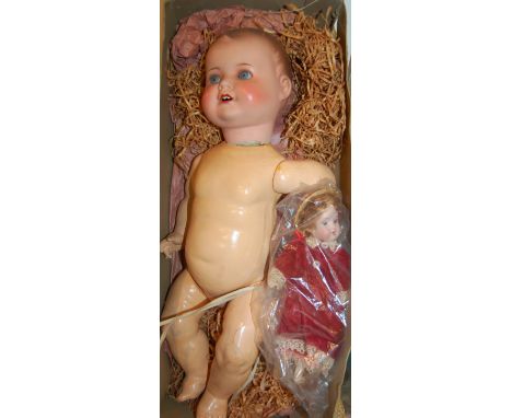 An early 20th century bisque headed Armand Marseilles German doll; together with one other smaller example (2)  Condition Rep