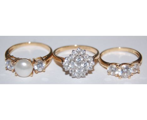 A ladies 14ct gold and white sapphire set cluster ring and two other gold semi precious set dress rings (3)