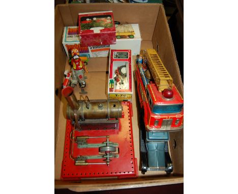 A box of mixed toys to include; tinplate stationary engine, Japanese tinplate fire engine, boxed Japanese tractor etc 