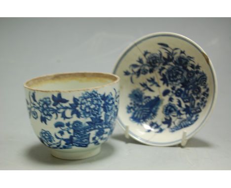 An 18th century Worcester footed bowl, underglaze blue decorated in the Fence pattern, with matching saucer (a/f) (2) 