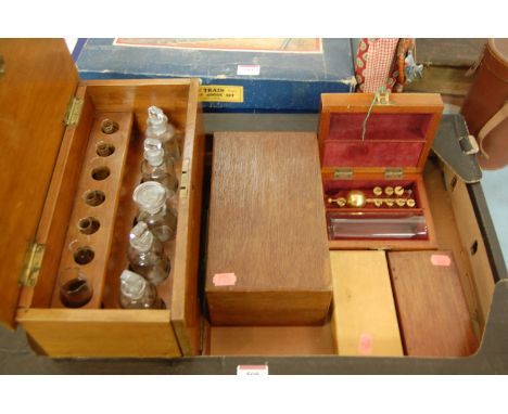 A mixed lot to include; cased set of chemists bottles, cased set of chemists scales, chemists weights