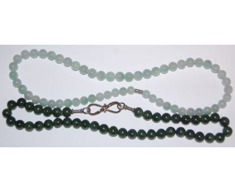 A modern beaded celadon jade necklace and one other green jade example (2)