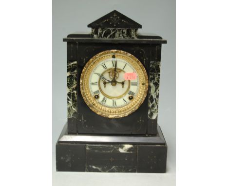 A late 19th century slate mantel clock of architectural outline with outside count wheel