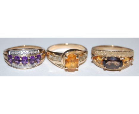 A modern 9ct gold amethyst and diamond point set dress ring, 9ct gold citrine set ring, and one other modern gold 9ct semi pr