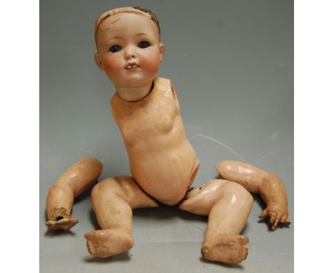An early 20th century bisque headed German doll, stamped Melitta (a/f)