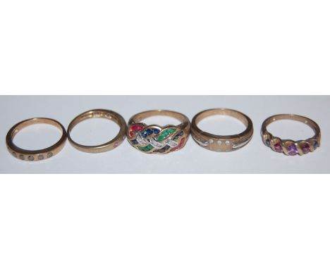 A modern 9ct gold diamond point set dress ring; and 4 other 9ct semi-precious set rings (5)  Condition Report / Extra Informa