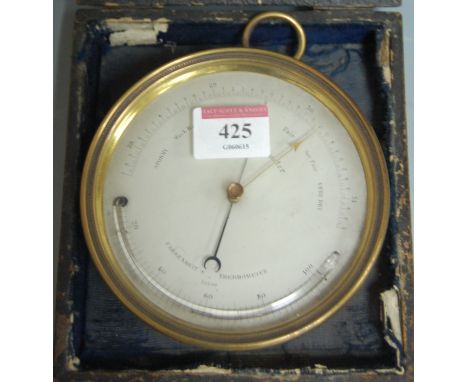 A late 19th century cased brass ships barometer, marked verso 'Sold by E & E Manuel, The Hard, Portsea'