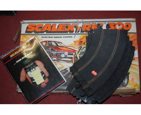 A boxed Scalextric 300 with additional loose track 