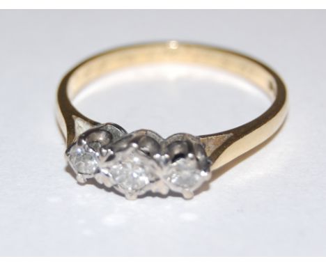 An early 20th century 18ct gold three diamond ring