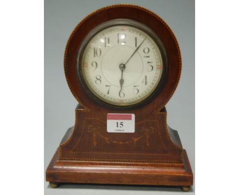 An early 20th century inlaid mahogany mantel clock, having French brass eight day cylinder movement