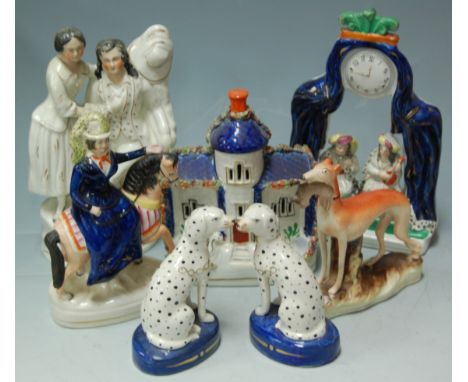 A quantity of Staffordshire wares 19th and 20th century to include pastille burner, watch holder, hunting hounds, etc