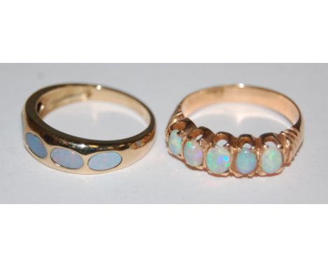 A ladies yellow gold and 5 cabochon opal set ring, and one other 9ct opal set ring (2)