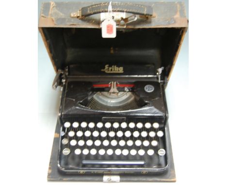 A mid-20th century cased Seidel & Naumann of Dresden Erika typewriter with SS runes on number 3 key