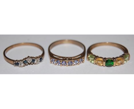 A ladies 9ct gold sapphire and diamond set wishbone ring and two other 9ct gold semi-precious set dress rings (3)
