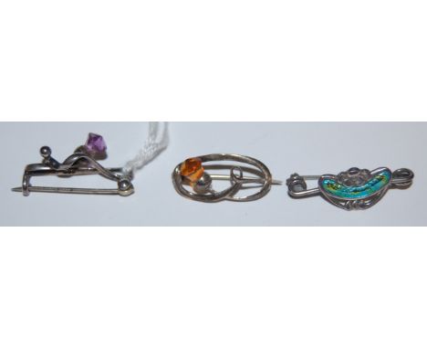 A Charles Horner Art Nouveau silver and enamel brooch, Chester 1909, and two other Charles Horner brooches to include amethys