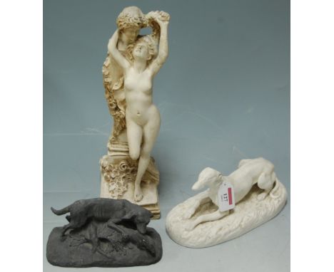 A bisque recumbent hound; cast metal hunting dog; and a composition female nude figurine (3)