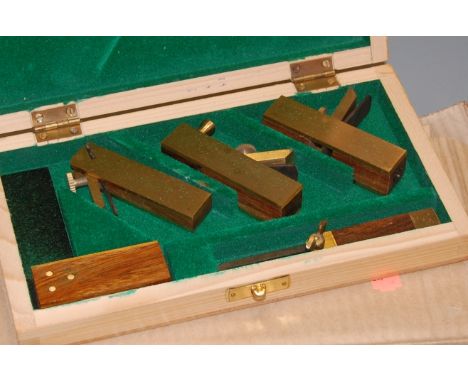 Three pairs of cased scales; together with a cased set of miniature woodworking planes (4)