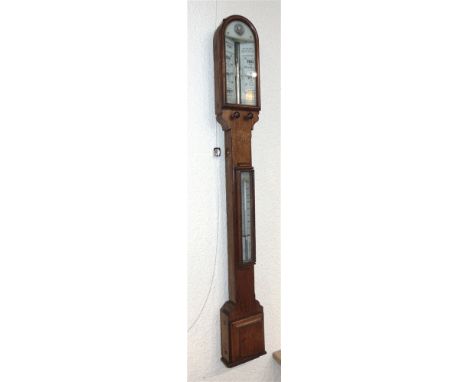 AN OAK CASED STICK BAROMOTER / THERMOMETER  by the 'Army & Navy Co-operative Society London', 99cm high