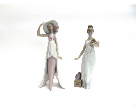 TWO LLADRO FIGURES OF LADIES  one holding a puppy, the other with a wide brimmed hat, both approx 35cm high