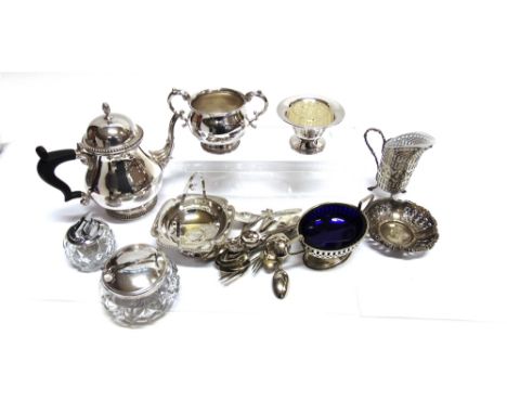 A PLATED THREE PIECE TEA SERVICE  with a plated cream jug with glass liner, tea strainer and other items.
