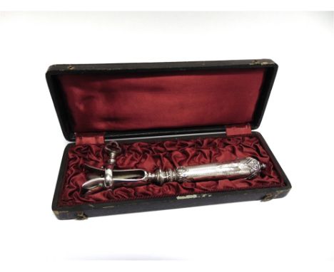 A FRENCH HAM BONE HOLDER  early 20th Century, with control marks to the loaded engine turned monogrammed handle, 21cm long, i