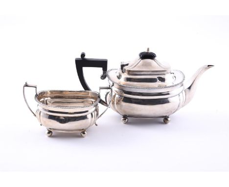 
	
		A SILVER OBLONG BALUSTER TEA POT AND SUGAR BOWL
		HAMILTON &amp; CO. (OF CALCUTTA), BIRMINGHAM 1915
		The teapot with a 