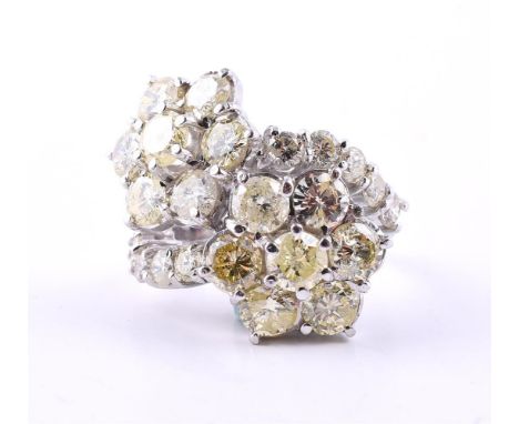 
	
		A DIAMOND DOUBLE CLUSTER RING
		The yellow tinted double diamond clusters to crossover shoulders, approximately 4.30 car