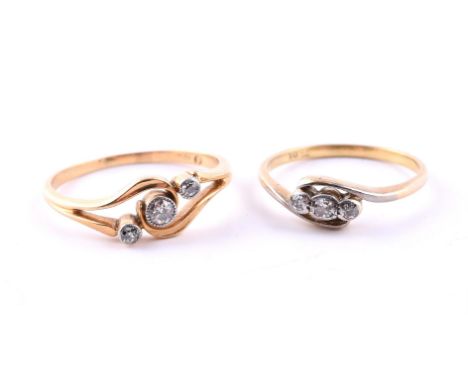 
	
		TWO EDWARDIAN DIAMOND RINGS
		The first with three old cut diamonds and gold crossover setting with polished leaf detail