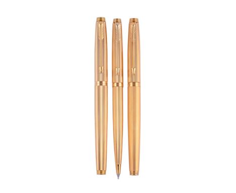 
	
		PARKER, 75  
		A GILT FOUNTAIN PEN, ROLLER BALL AND PENCIL
		Cap and Barrel: With striated gilt caps and barrels, arrow 