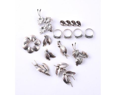 
	
		NIELS ERIK FROM, A SMALL COLLECTION OF VINTAGE SILVER COLOURED JEWELLERY
		Comprising three foliate spray brooches, with