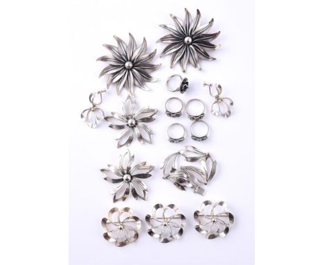 
	
		NIELS ERIK FROM, A COLLECTION OF VINTAGE SILVER COLOURED FLOWER HEAD JEWELLERY
		Comprising a petal bracelet, the pierce