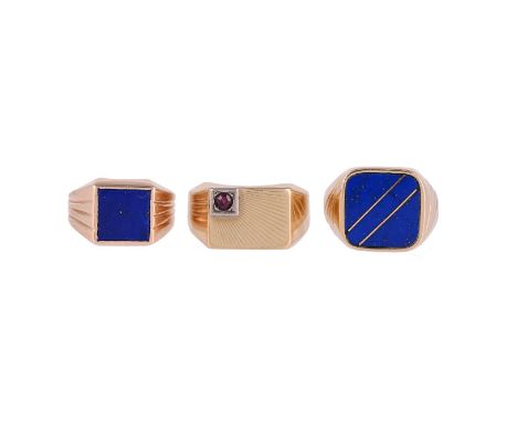 
	
		THREE SIGNET RINGS
		The first with a polished lapis lazuli penal, with inset gold coloured bars, stamped 14k 585; the s