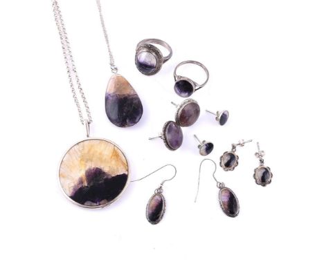 
	
		A COLLECTION OF BLUE JOHN JEWELLERY
		Comprising a polished circular Blue John and silver pendant, Sheffield 1980, on a 