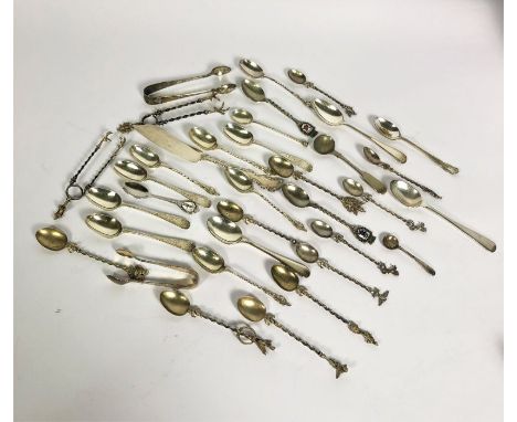 A group of assorted silver flatware, including Victorian bright cut silver tea spoons, a group of silver apostle spoons and a