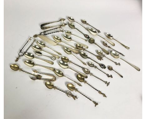 A group of assorted silver flatware, including Victorian bright cut silver tea spoons, a group of silver apostle spoons and a