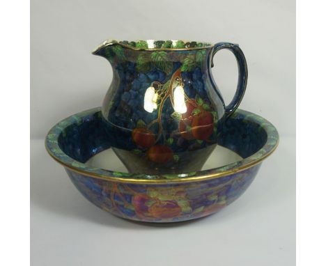 A group of Maling lustre ware, including a large jug and basin, decorated with fruit, a ginger jar and related (a lot)