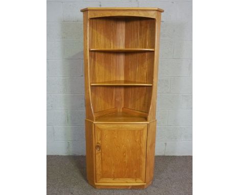 A modern Ercol ash corner cabinet, floor-standing, with two shelves and cabinet, Ercol label, 180cm high, 73cm wide