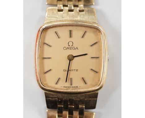 A lady's 9ct gold Omega quartz wrist watch, on a 9ct gold Omega bracelet, overall 17.3cm, gross weight 29 grams, with Omega b