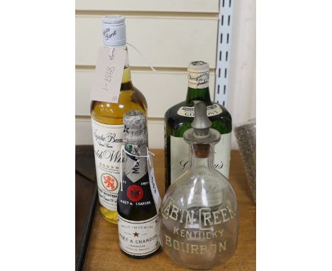 A bottle of (approx 70cl) Gordon's Special Dry London Gin, a bottle of 75cl Augustus Barnett Special Reserve Scotch Whisky, a