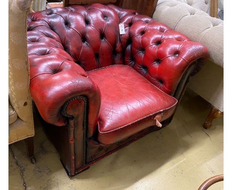 A Victorian style red leather button back Chesterfield armchair, width 104cm, depth 86cm, height 68cm