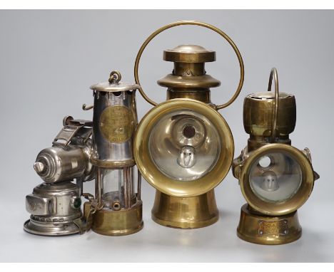 A miner's lamp stamped Seaham, and two Lucas road lamps and a H &amp; B side lamp, No. 1001, largest 30cms high