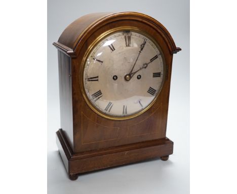A late 19th/early 20th century mahogany mantel clock with German striking movement and convex silvered dial. 38cm tall
